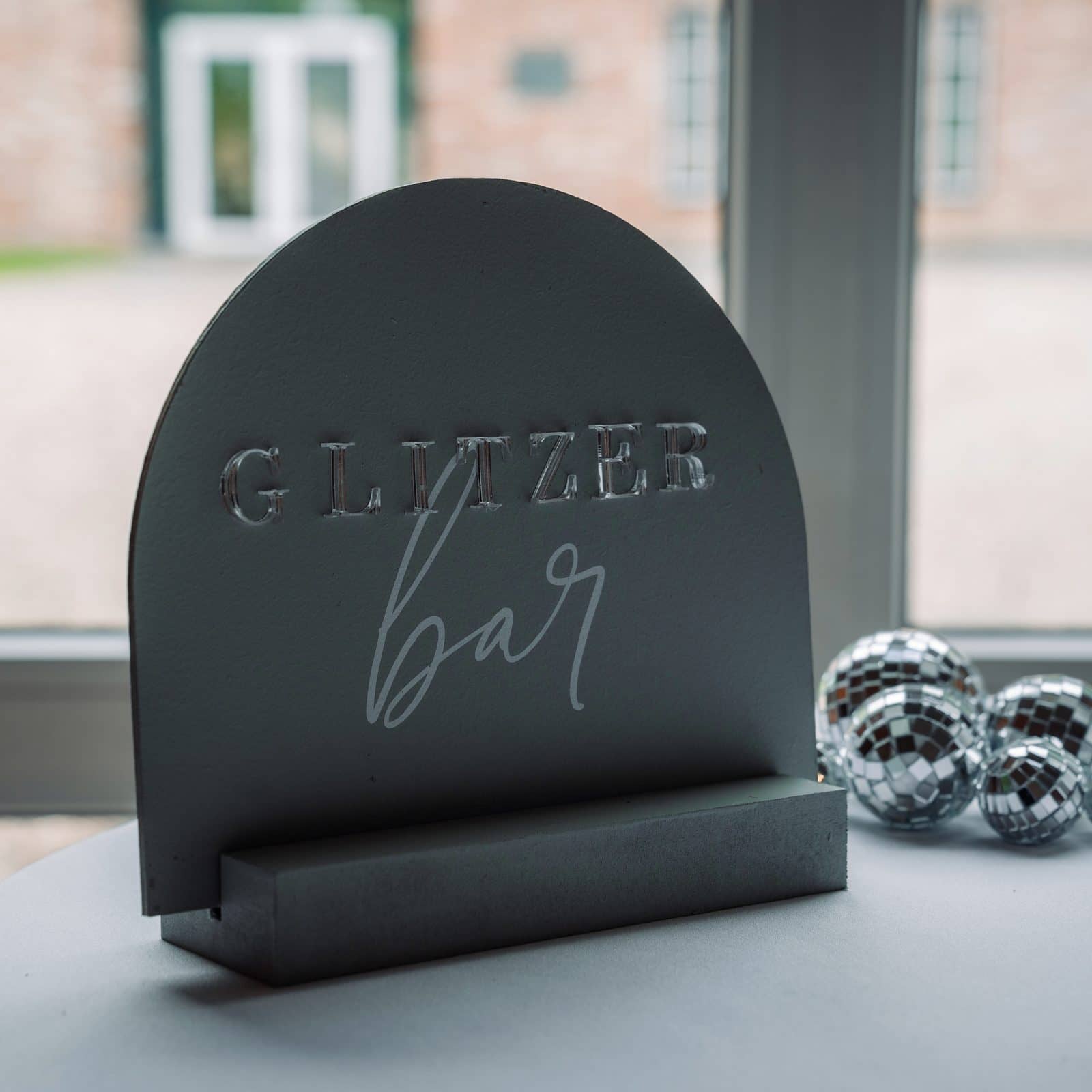 Schild „Glitzerbar“